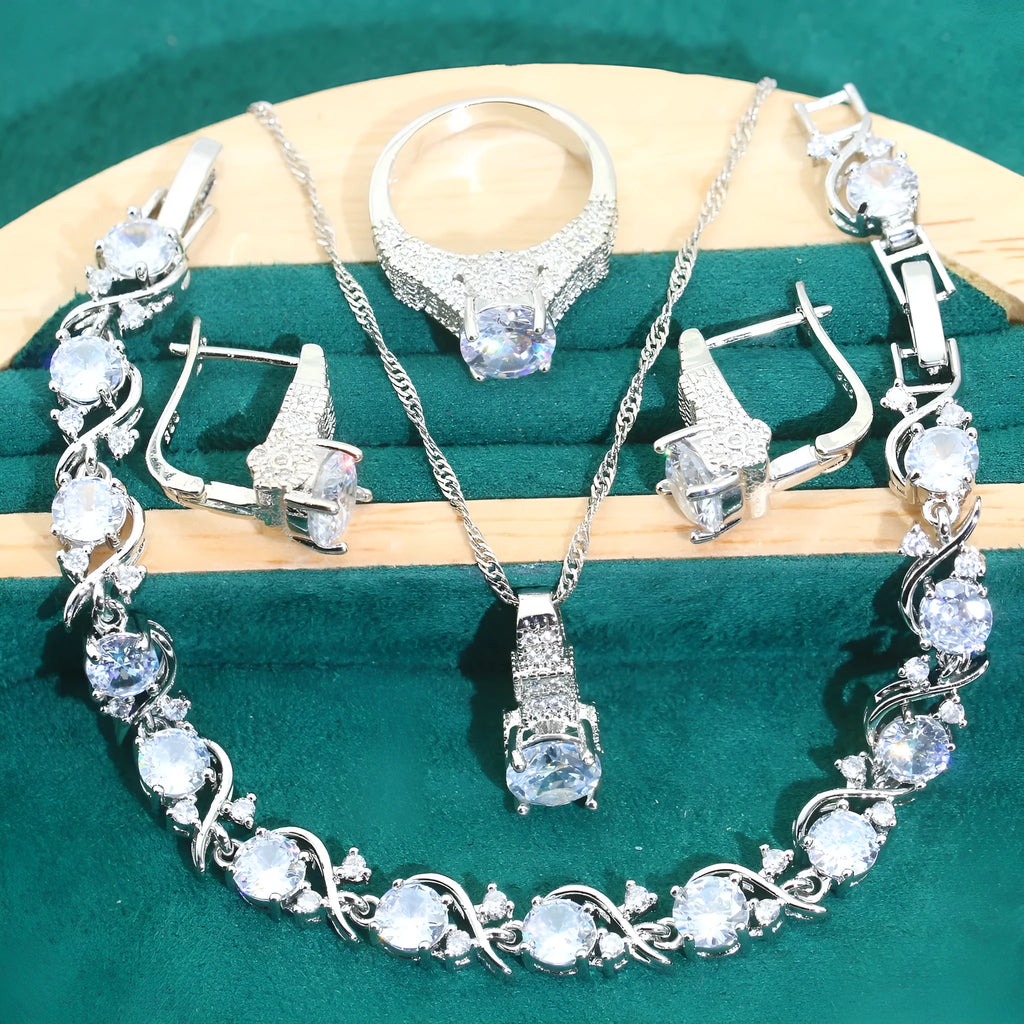 Four-piece bridal jewellery set showing zircon necklace, bracelet, earrings and ring with water wave chain design