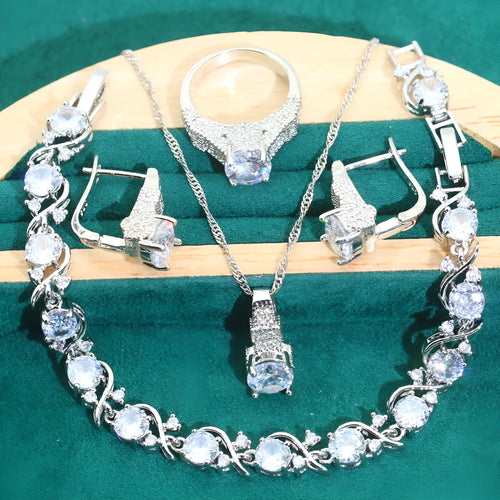Four-piece bridal jewellery set showing zircon necklace, bracelet, earrings and ring with water wave chain design