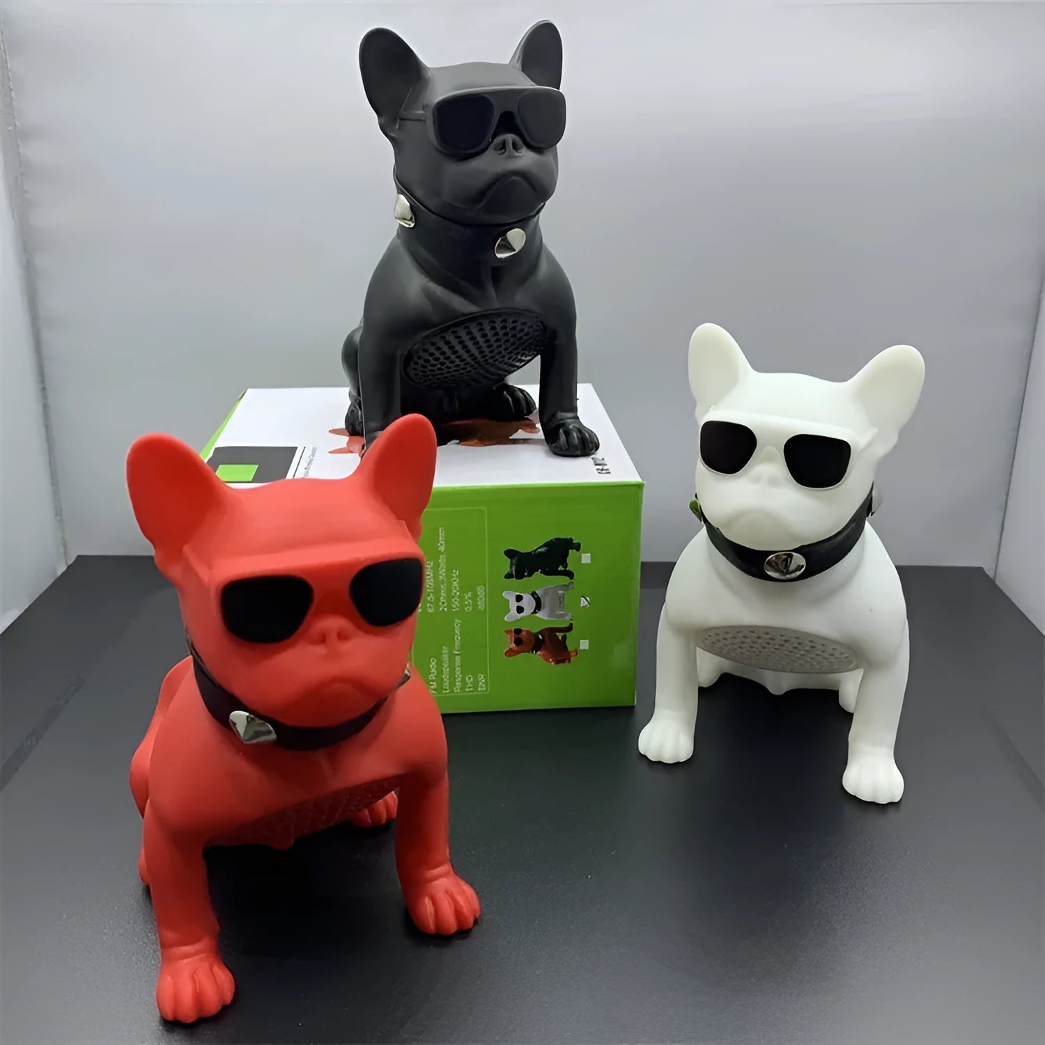 Mini bulldog-shaped Bluetooth speaker in black, red, and white colour options.
