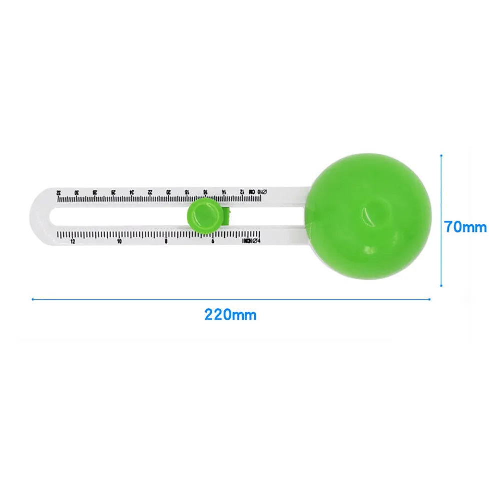Orange plastic round paper cutter for A3 sheets on a colour box