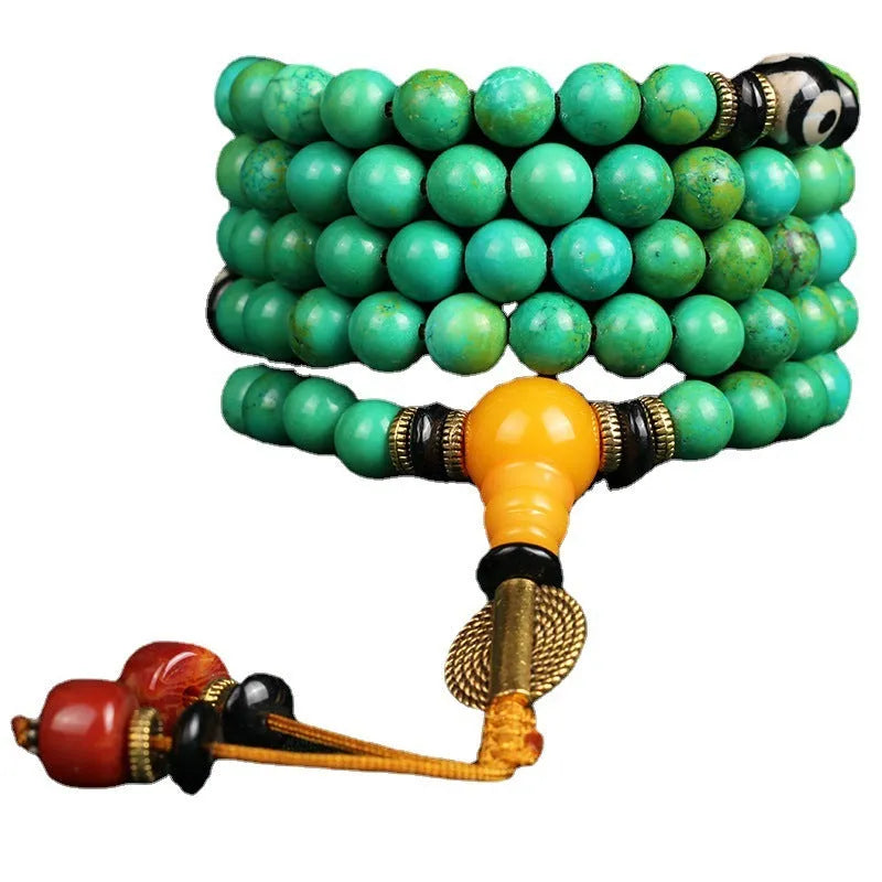 Natural turquoise gemstone bracelet with 108 round 8mm polished beads on a string.