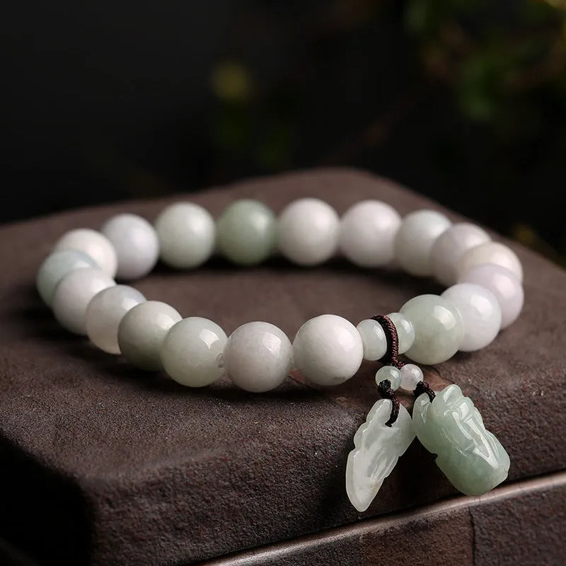 Natural green jade bracelet with geometric links and a carved Maitreya Buddha pendant.