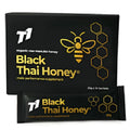 A 1kg glass jar of dark-coloured T1 Black Thai Honey with a label.