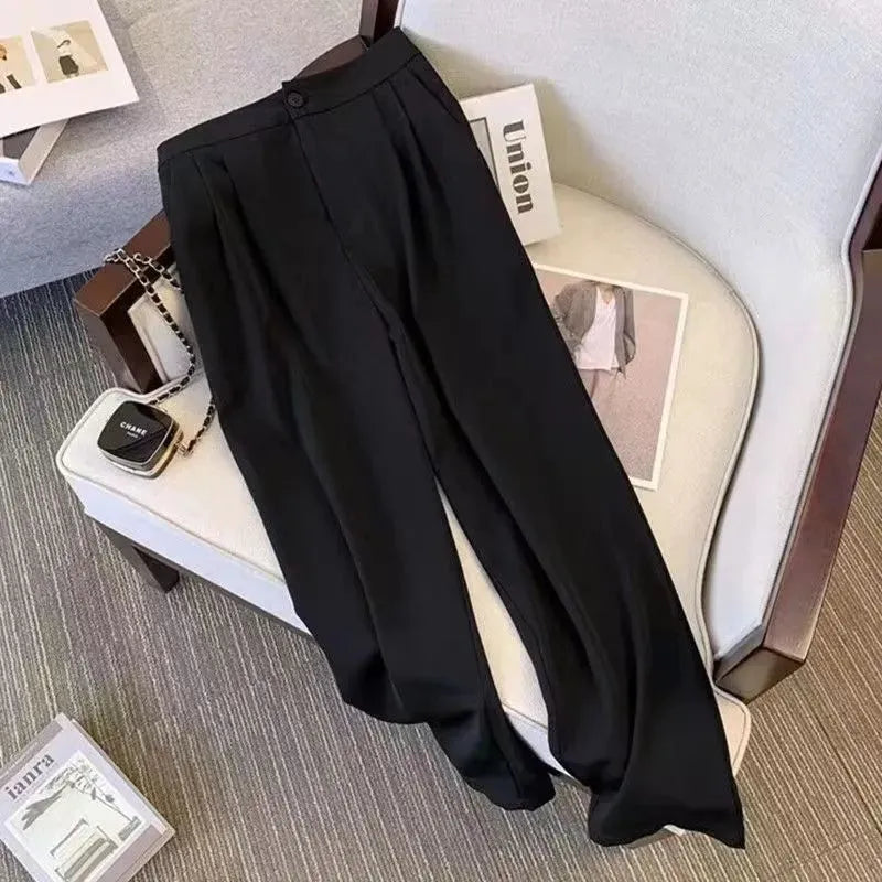 Women's loose fit polyester blouse in black colour with regular sleeves and slimming silhouette