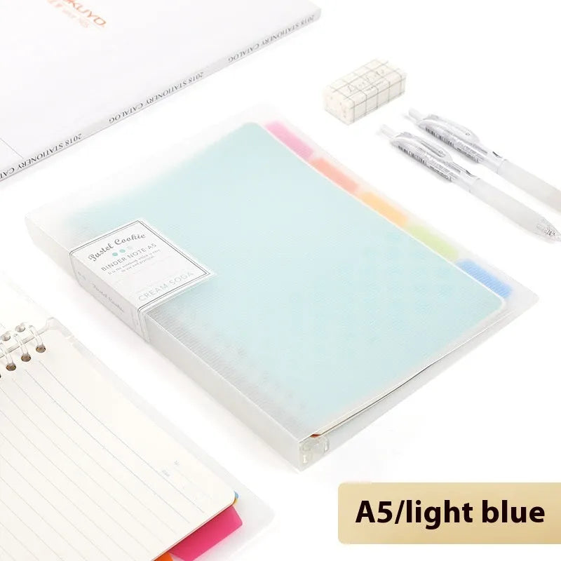 Loose-leaf spiral notebook with PP cover open, showing raw wood pulp pages in A5 or B5 size.