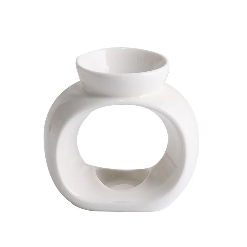 White ceramic Nordic style aromatherapy stove ornament with retro domestic design on tabletop