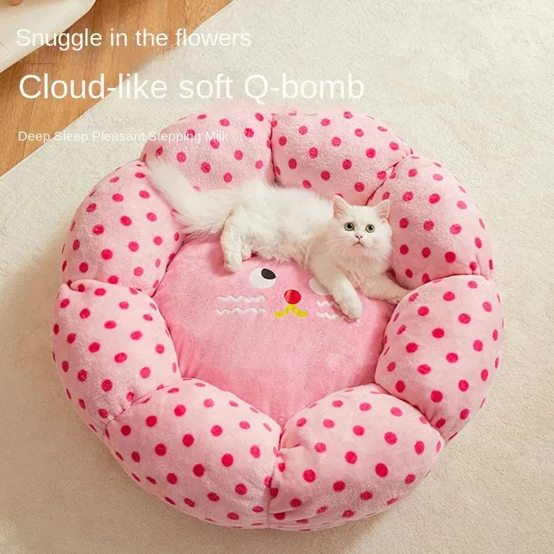 Round pink cat bed with dot pattern and cushion for indoor sleeping