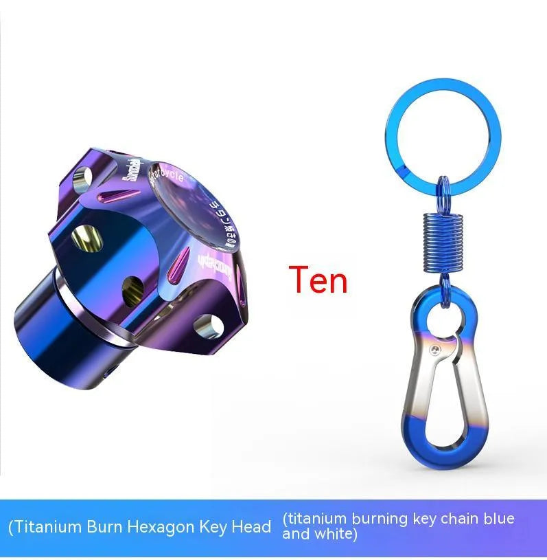T6 aluminium motorcycle key cover in hexagonal, pentagram, and plum blossom designs with blue and white keychain.