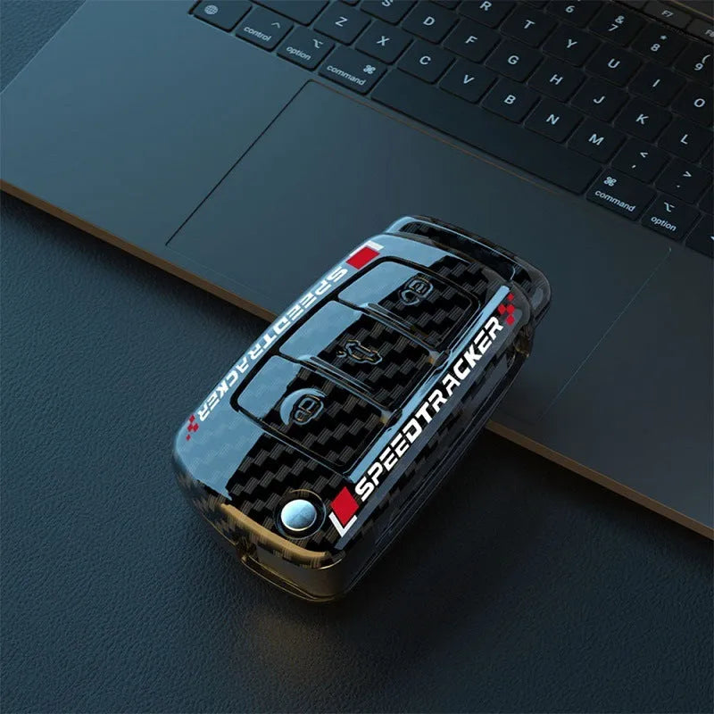Car key cover with carbon fibre texture and mirrored detailing, white colour option shown alongside