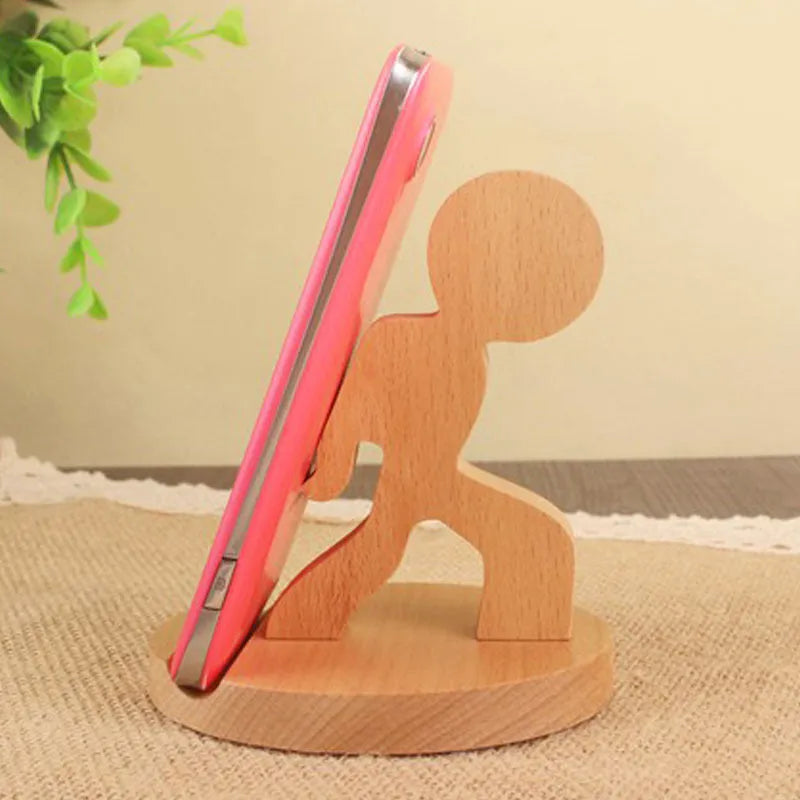 Beech wood mobile phone holder stand with coin slot and decorative carving.