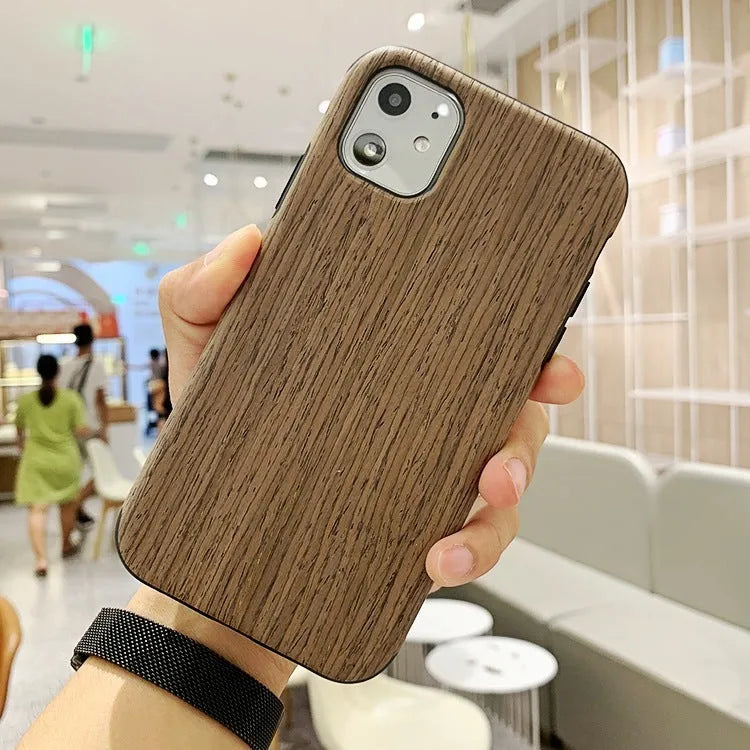 Wooden iPhone case with natural wood grain showing rosewood finish on iPhone 11 Pro