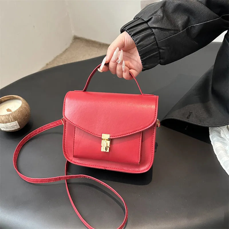 Retro style PU messenger bag in horizontal square format with sandwich pocket and crossbody strap