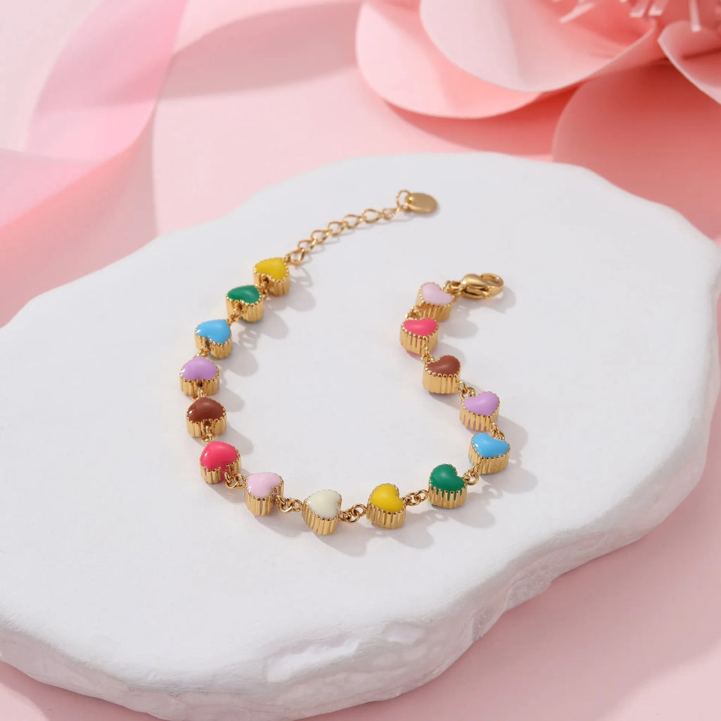 Gold or steel coloured women's bracelet with heart-shaped titanium steel pendant on stainless steel band