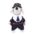 Pet dog wearing cartoon cowboy costume with hat, standing on grass