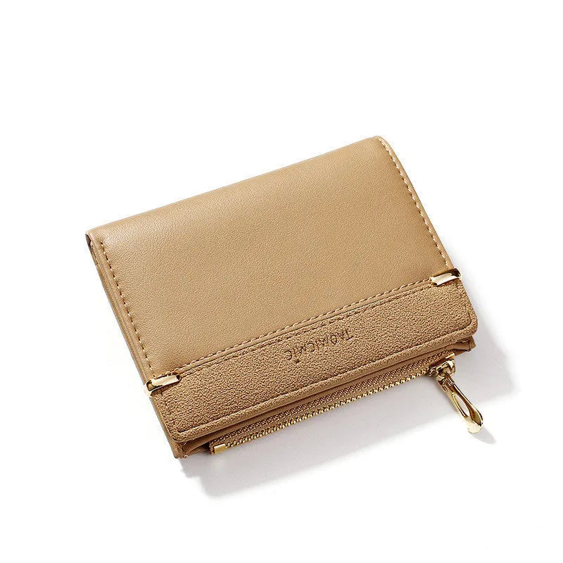 A closed ladies short zipper wallet in PU leather, showing its compact 2-fold design.