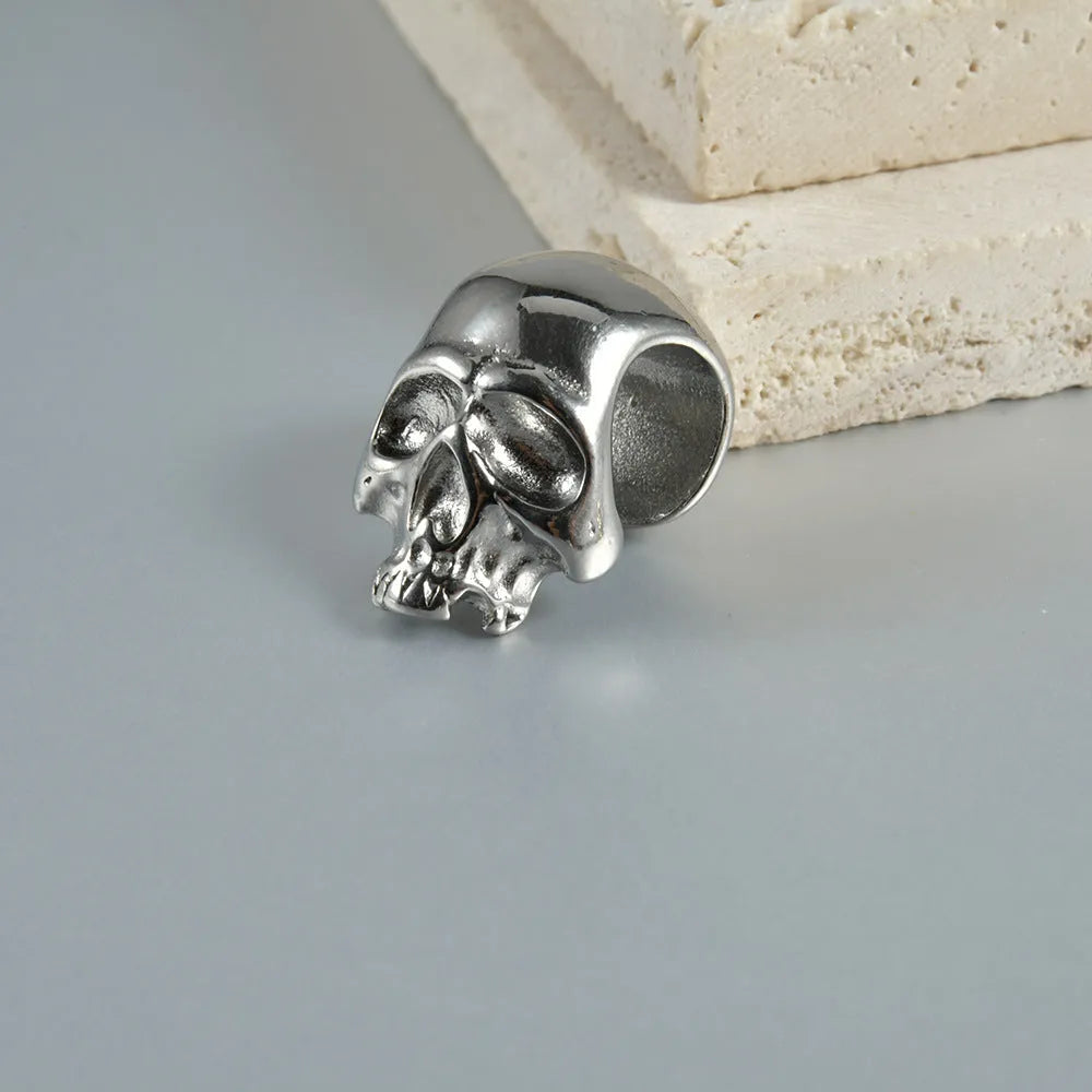 Stainless steel hollow skull Buddha earrings showing geometry shape and electroplated colour options