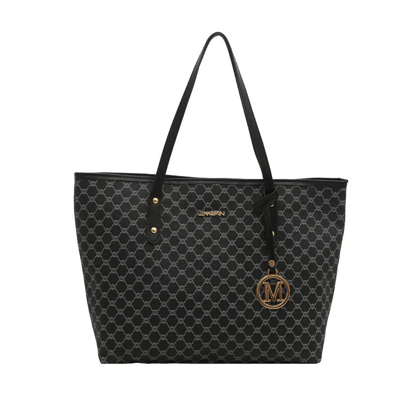 Street trend western style shoulder bag in PU material with sewn detailing, shown in black.