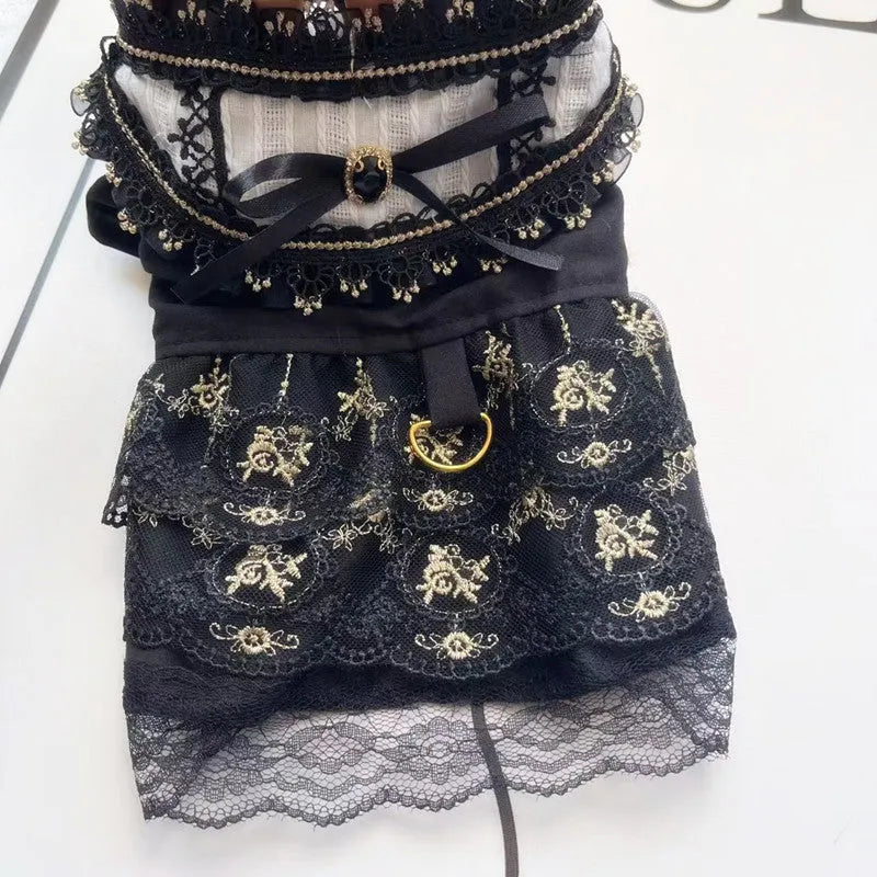 Golden Gothic princess skirt costume for a small dog on a mannequin, showing the tiered skirt design.