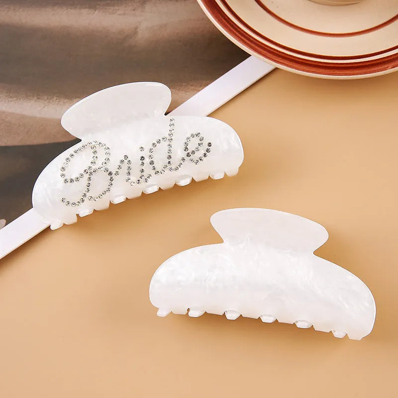 10cm long acrylic shower shark hair clip with diamond spot drill decoration in pink colour with back clip mechanism.