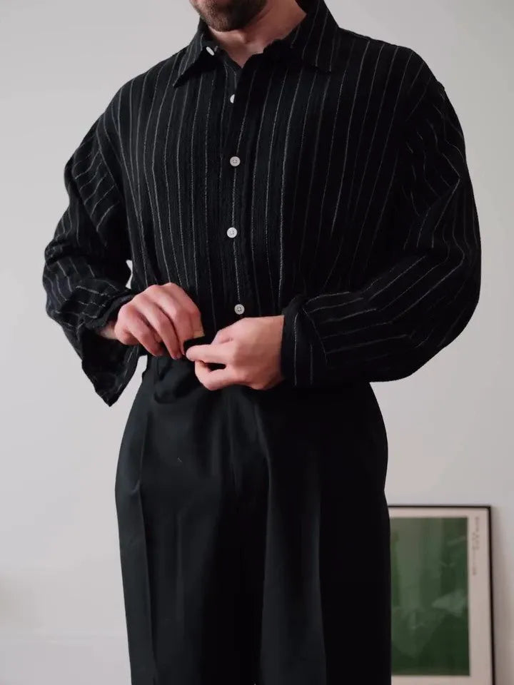 Men's black pinstriped long sleeve button-down shirt with a regular fit.