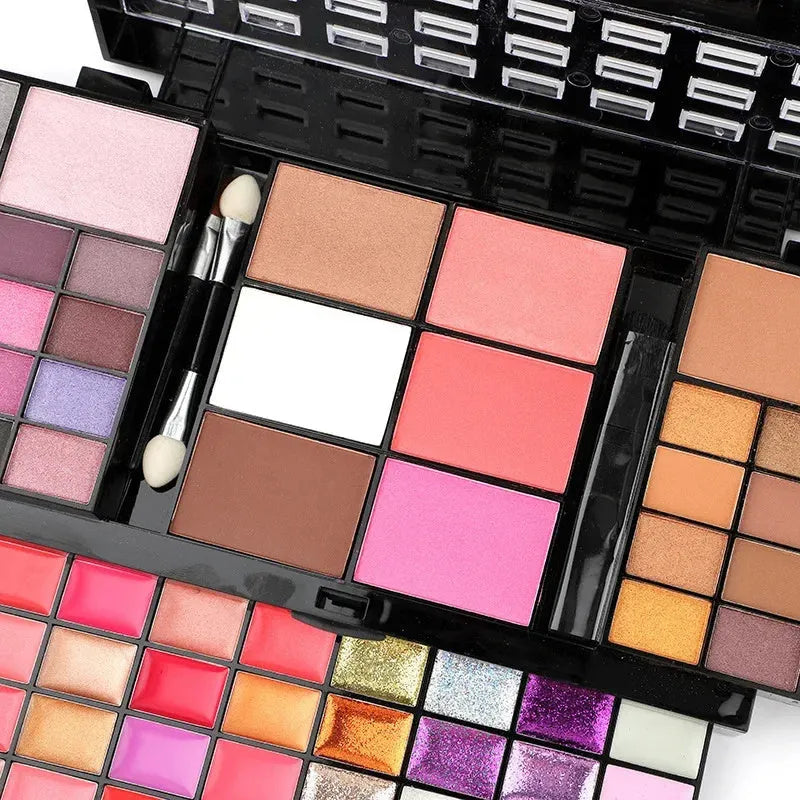 74 colour makeup palette set with four layers showing eyeshadows, lip glosses, and face powders with brushes