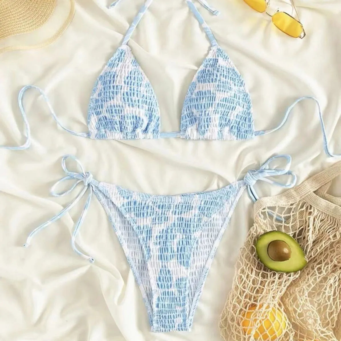 Women's floral halter neck swimsuit briefs in light blue on a mannequin