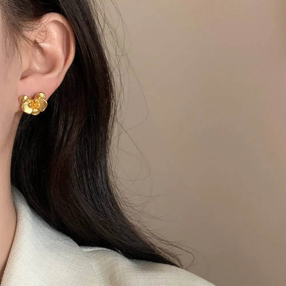 Retro flower earrings with petal detailing in gold or silver electroplated finish on copper