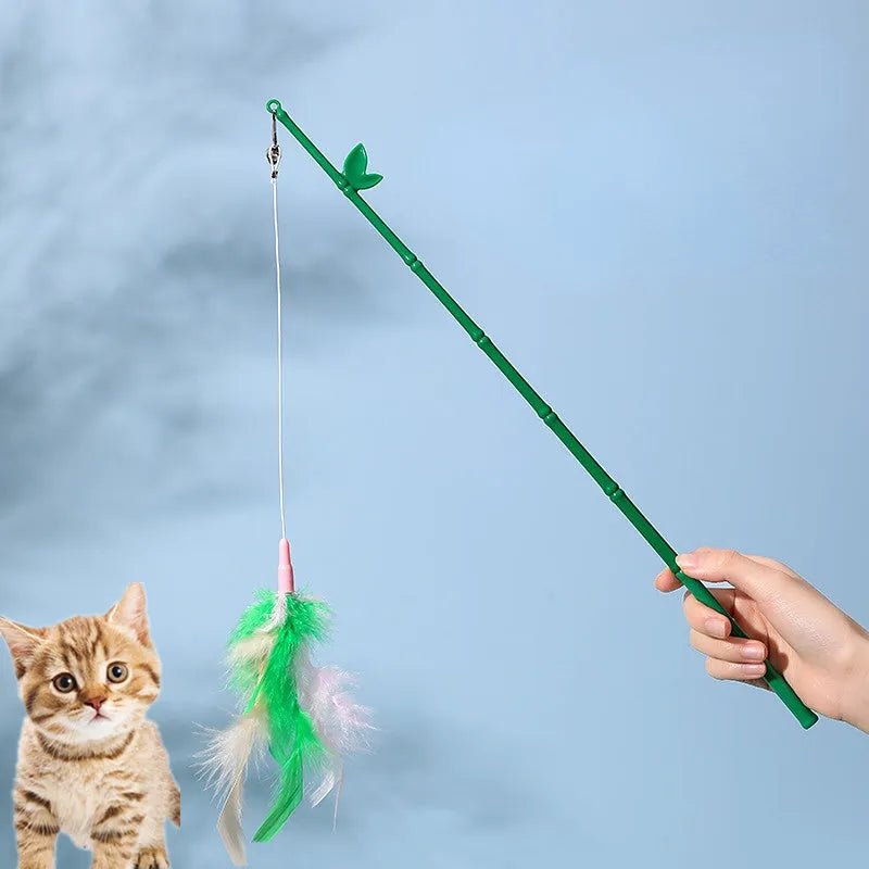 Green interactive cat feather wand toy with bell attachments for feline exercise and training