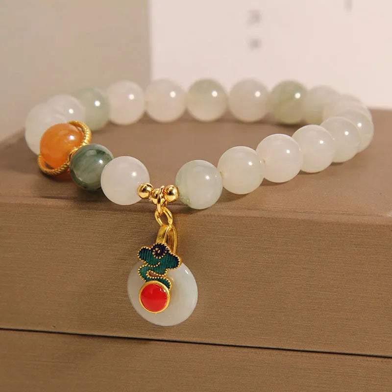 Women's genuine jade bracelet with an ice jade Xiangyun peace buckle and pearl decorative accents.