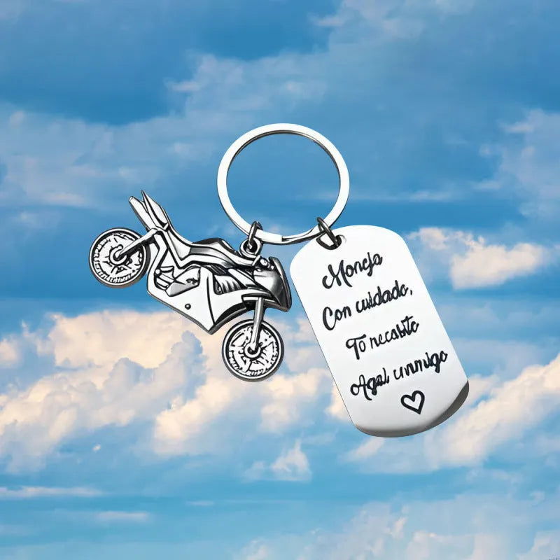 Stainless steel metal keychain on a velvet cloth, showing Motorcycle Keychain and Flannel Bag style options.