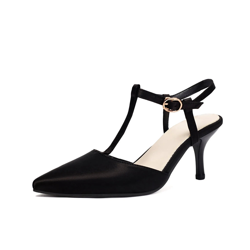 Women's pointed T-strap high heels in top grain leather, black colour, side view on plain background