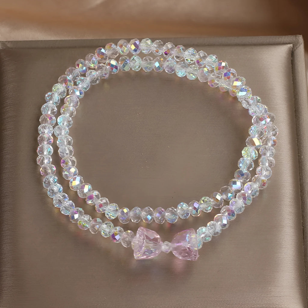 Women's double-circle crystal bow bracelet in white, green, and pink colour options on display