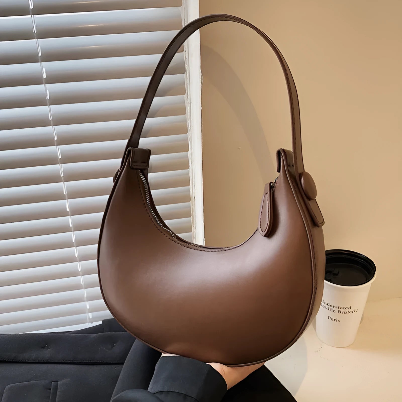 Women's retro dumpling shape shoulder bag in black with sandwich pocket and synthetic leather lining