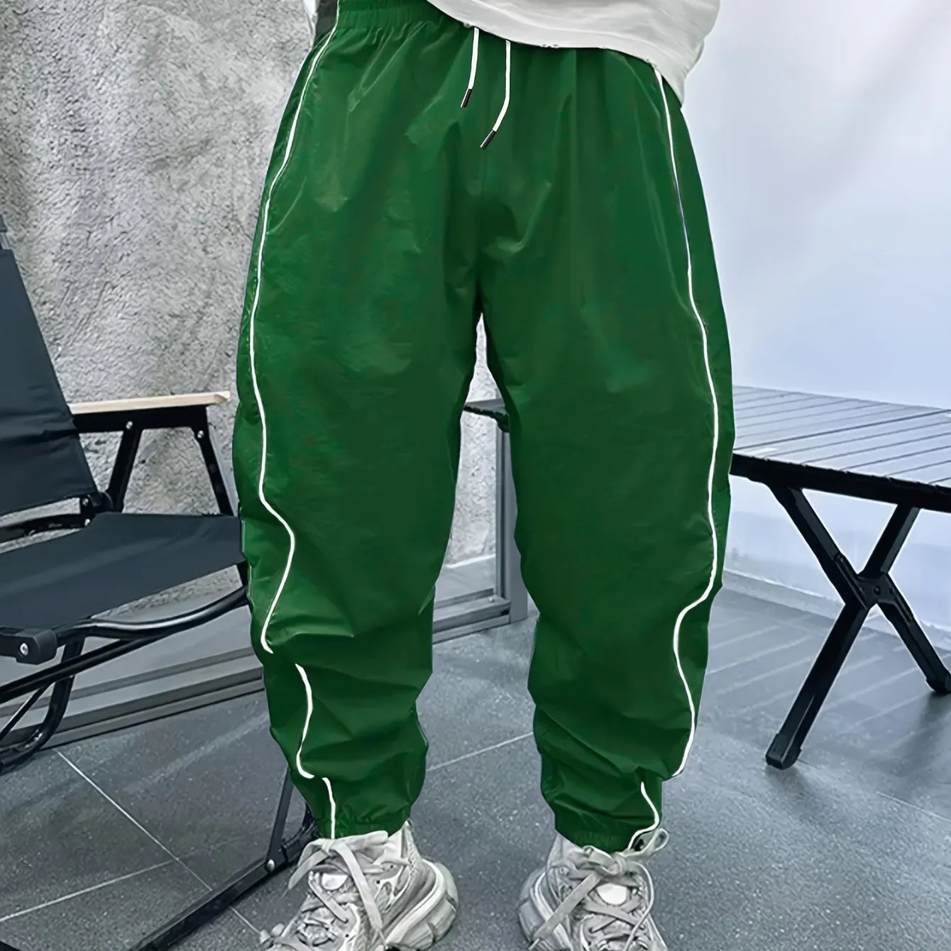 Men's loose fit cropped sports trousers in bamboo fibre, shown in Army Green colour.