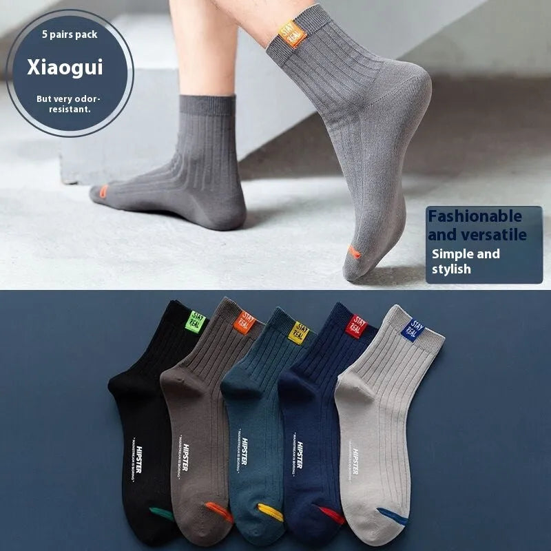 Sports mid-calf basketball deodorant men's socks in tube style with simple design and breathable fabric.