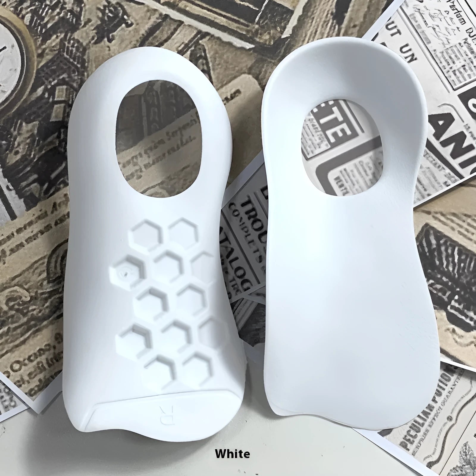 TPR arch support insoles for varus correction in white, black, and skin colour options