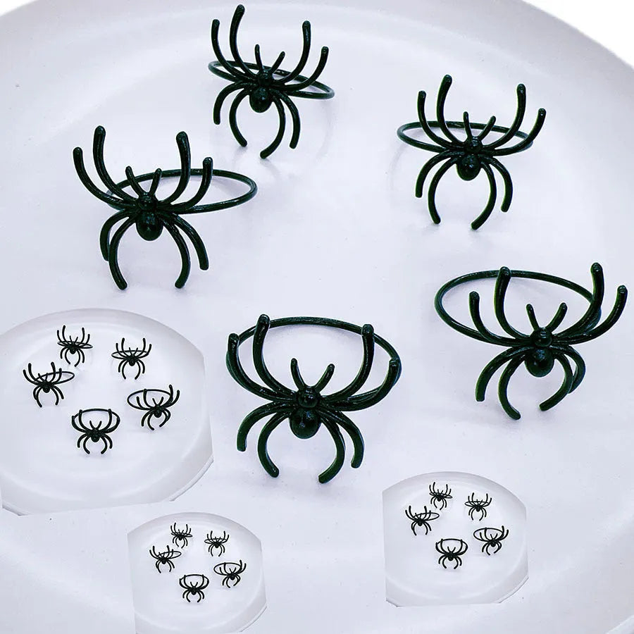 Six black spider alloy napkin rings for Halloween table decoration with electroplated finish