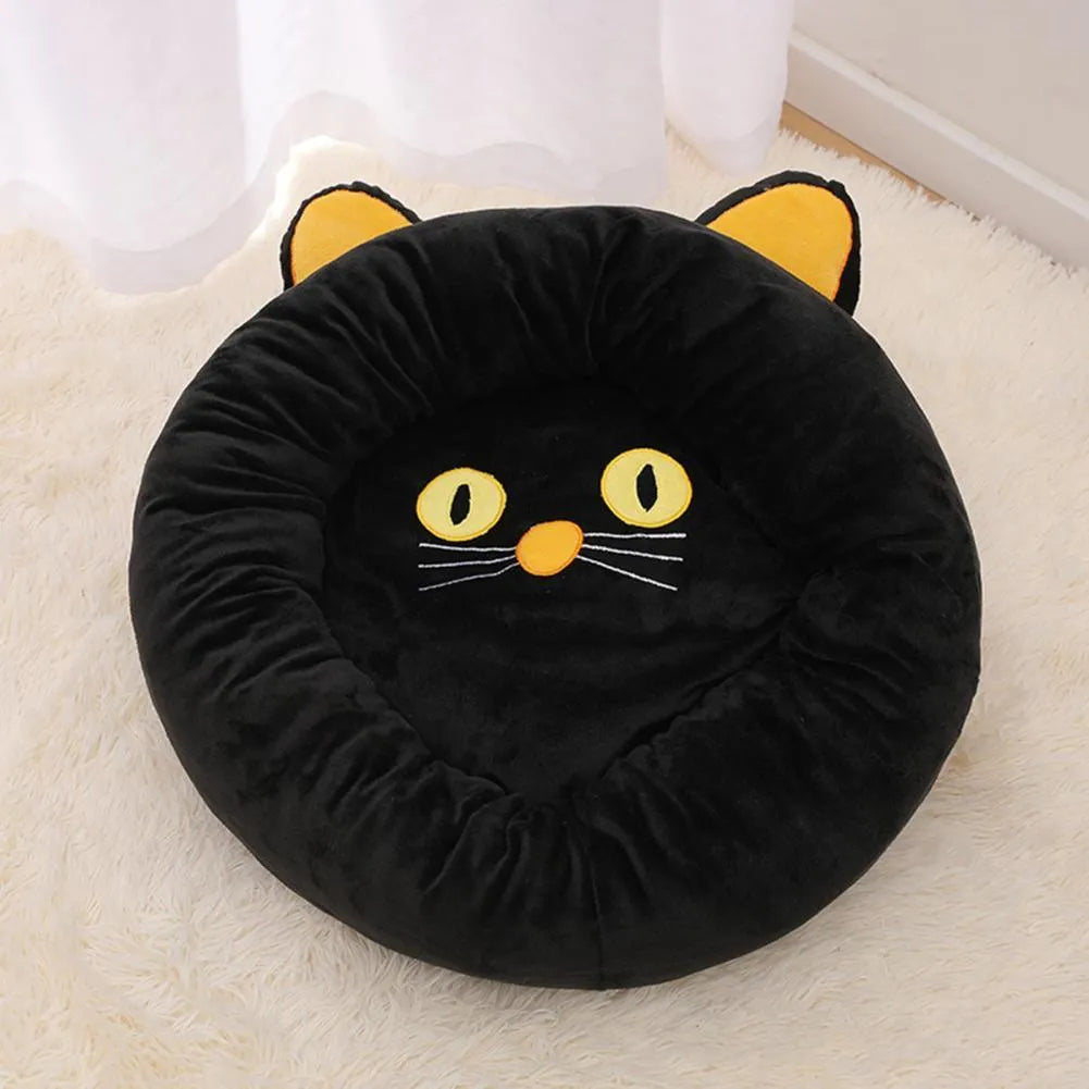 Black cat shape velvet pet nest bed with raised edges, 50cm diameter, on floor