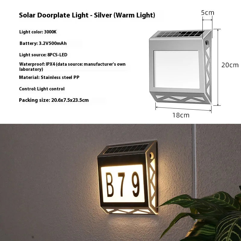 Solar powered doorplate light with LED indicator in black or silver finish, measuring 180x50x200mm