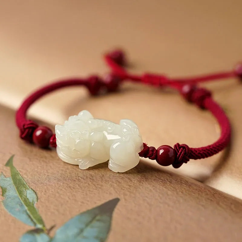 Hetian jade bracelet with braided rope closure in traditional Chinese style