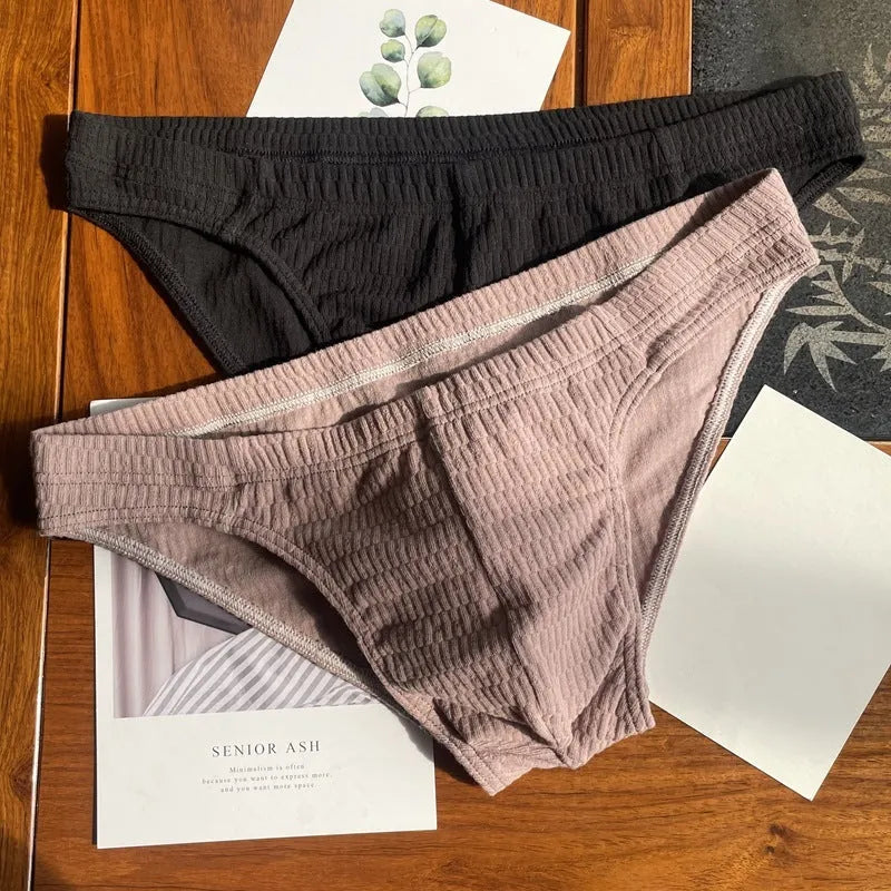 Men's solid colour pure cotton triangle briefs with a mid-waist body-shaping design.