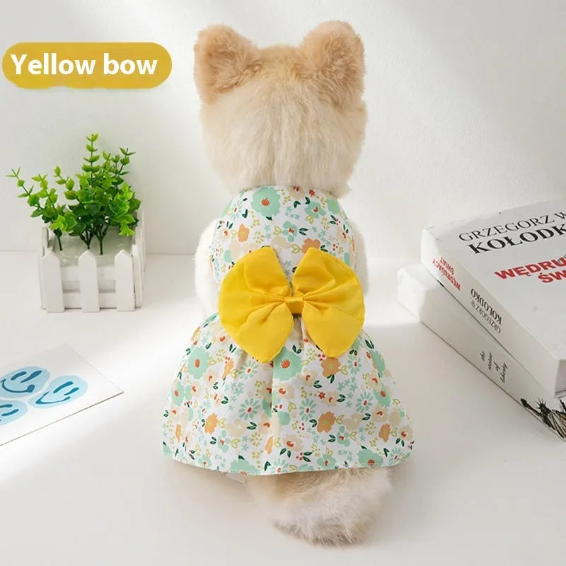 Ultra-thin floral butterfly knot princess dress for dog or cat on a hanger, showing bow colour options.