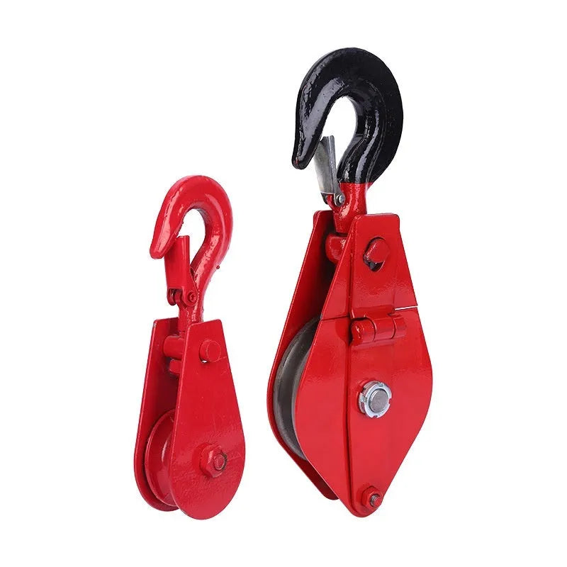 Red forged steel industrial lifting pulley with a safety latch on the hook