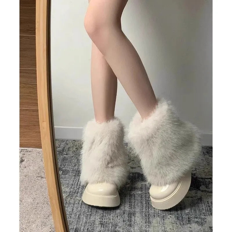 Women's black fleece-lined snow boots with waterproof platform and mid heel