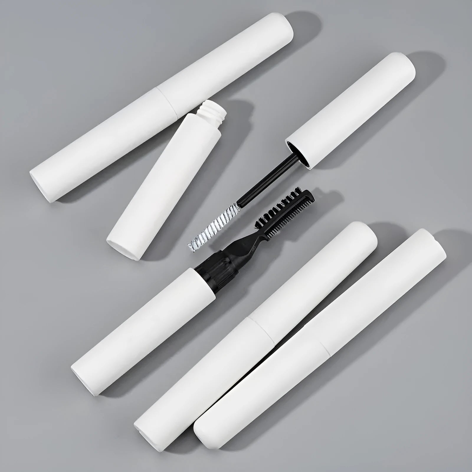 Eyebrow shaping glue with application brush in white and pink colour options