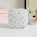 Women's key storage bag in floral polyester with sewing thread details, showing multiple colour and pattern options
