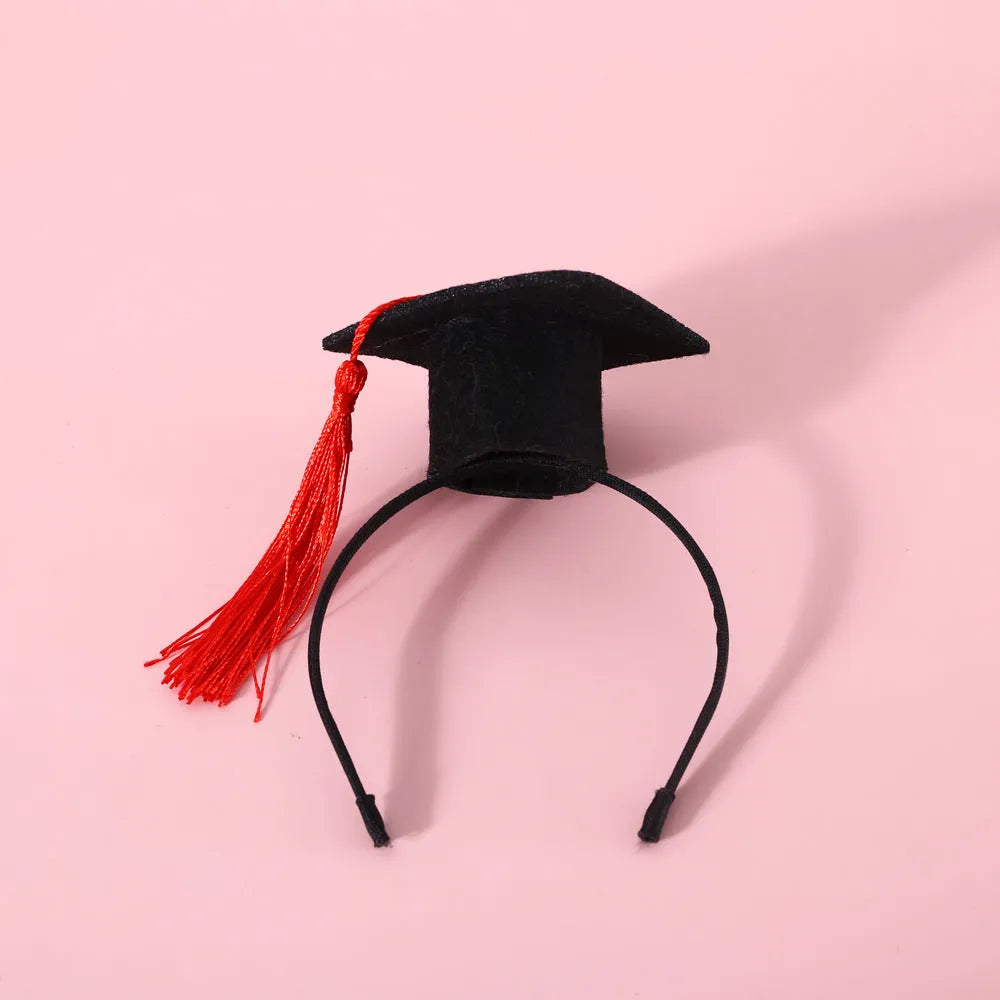 British-style Doctor's Degree elastic hair band and woolen felt bow tie set for a cat or dog, shown in yellow cap colour option.