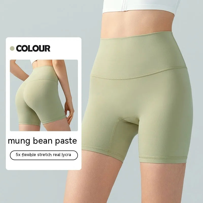 Women's high waist leaf green Lycra yoga shorts for fitness and cycling.