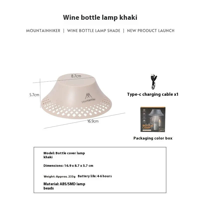 Beige wine bottle camping lantern with USB-C charging port and adjustable light modes on a wooden surface.