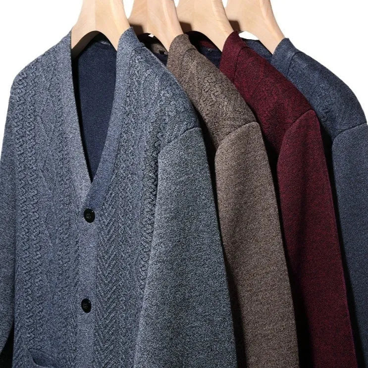 Man wearing a brown and white striped cardigan sweater with a wool lining.